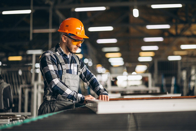 Manufacturing floor with industrial equipment and production staff
